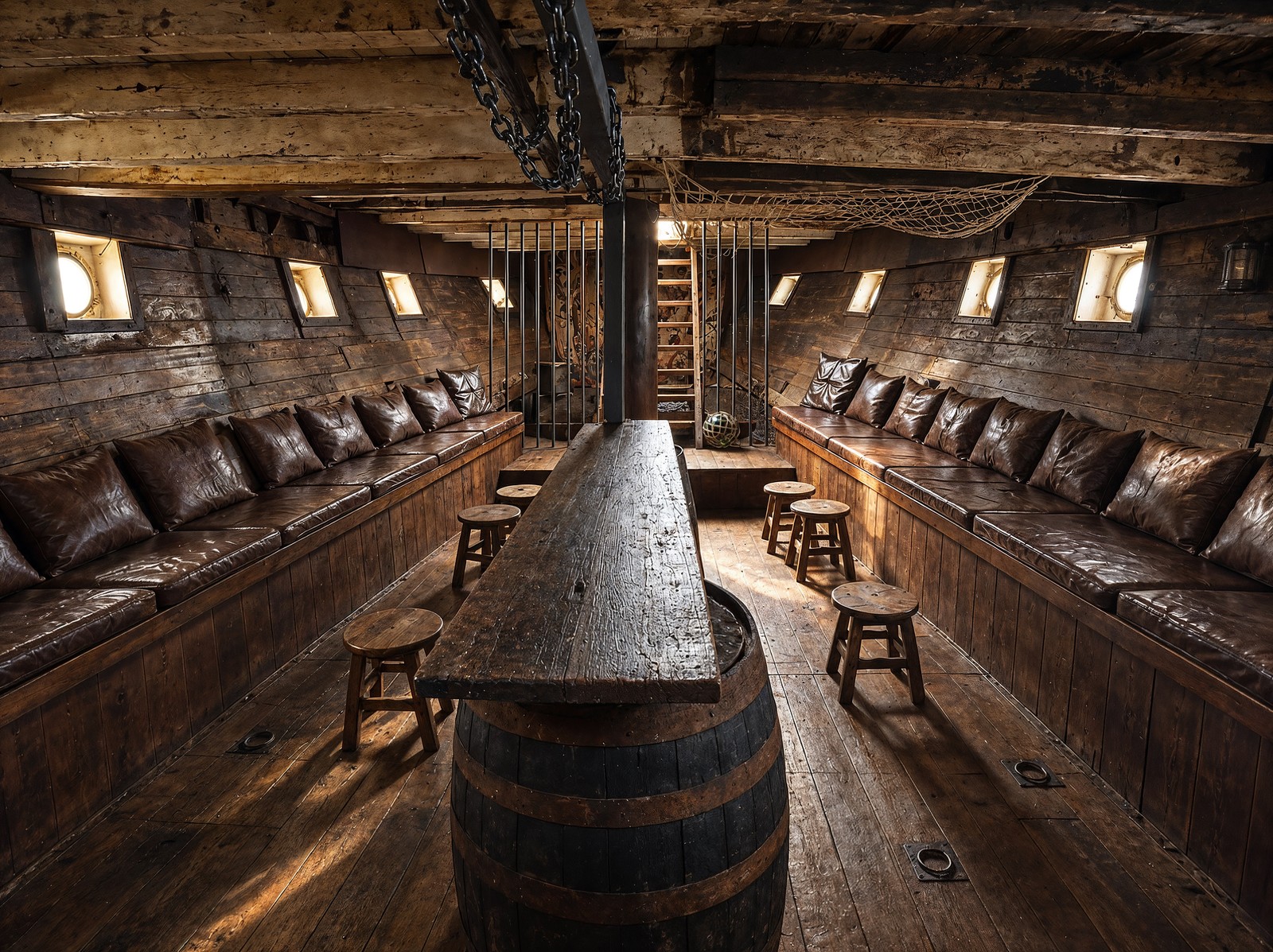 The Kraken's Hold — long leather bench seats and barrel stools running the length of the timber hull